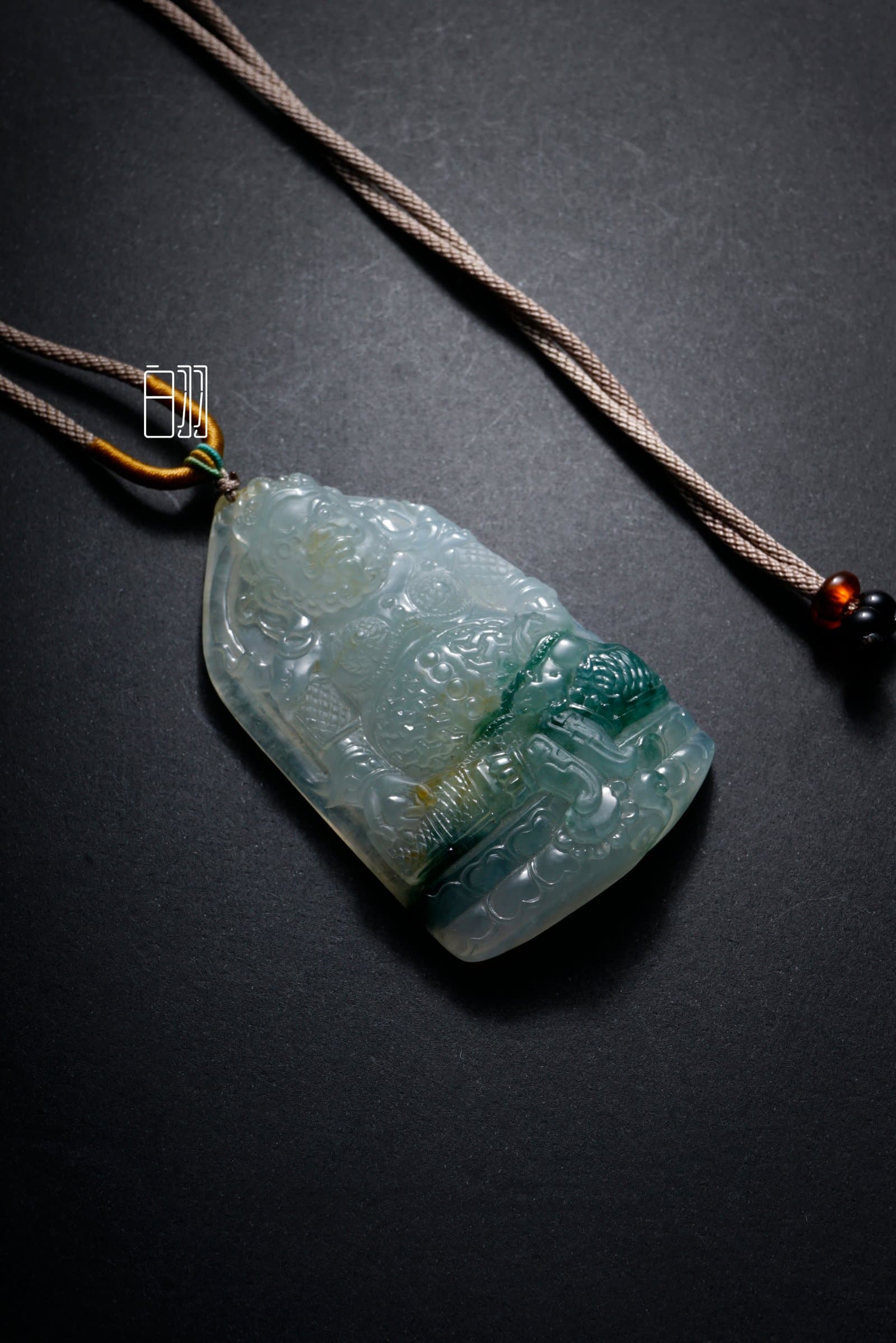 Icy Blue Sacred Image Jadeite Pendant in natural light