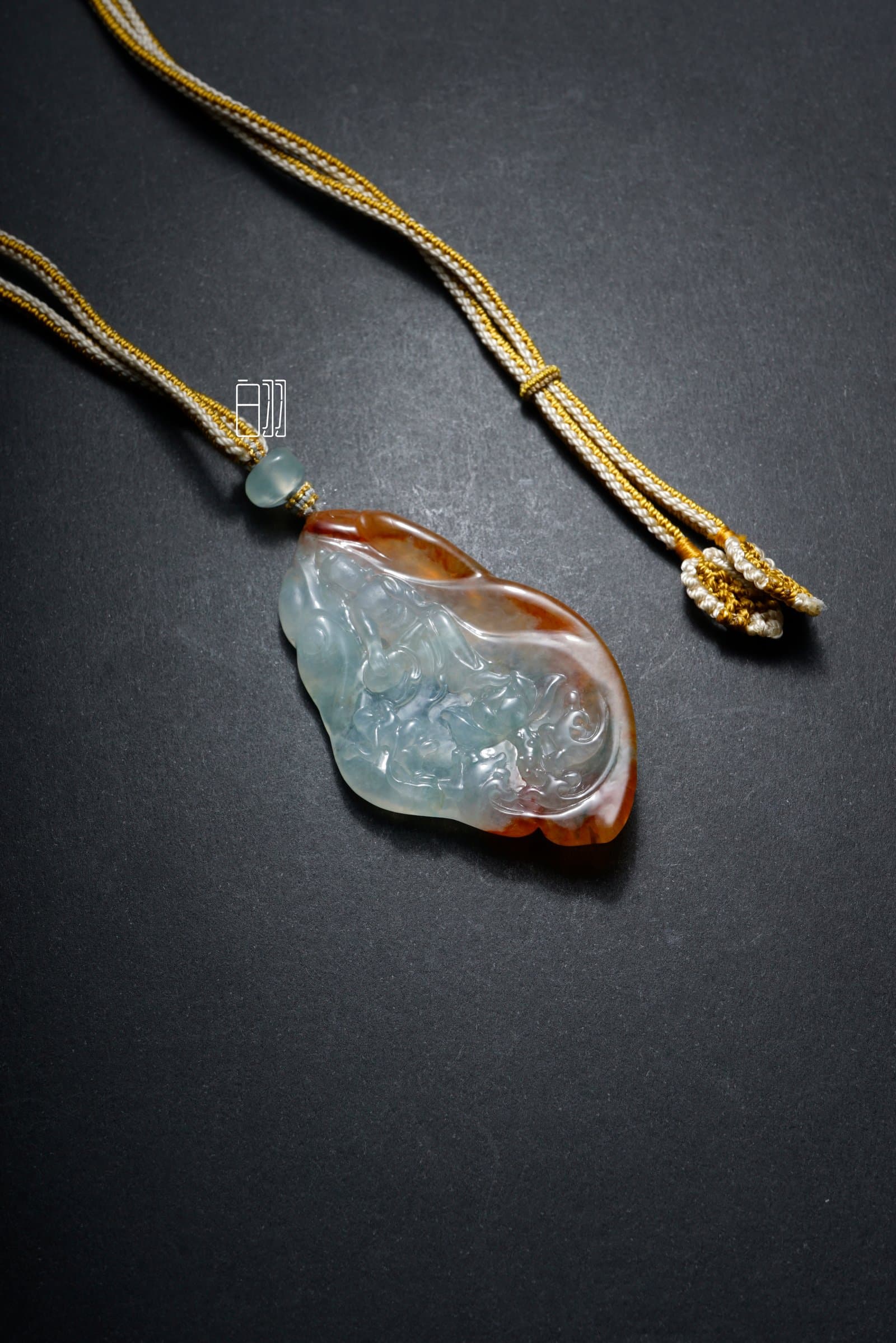Red & Icy Blue Spirit Fox Jadeite Pendant in natural light