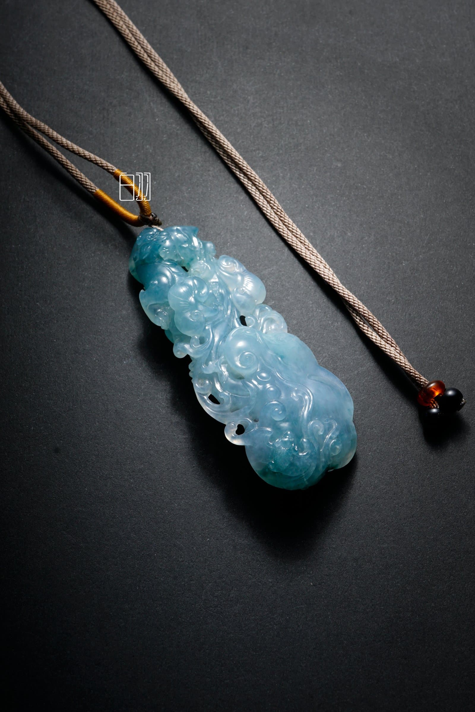 Icy Blue Soaring Dragon Jadeite Pendant in natural light